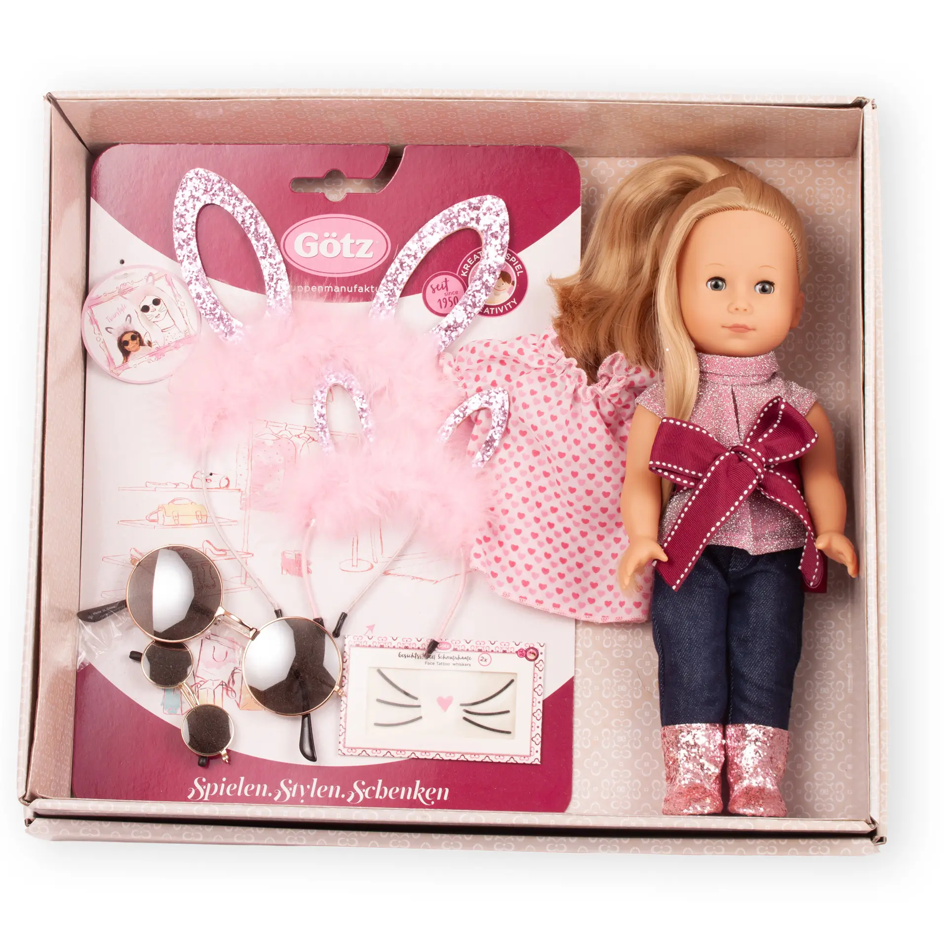 Oster-Geschenkbox mit Stehpuppe Gr. 27 cm mit blondem, langen Haar und blauen Schlafaugen. Bekleidet, zusaetzlich Kleid, Glitzerhaarreifen und Nickelbrillen fuer Kind und Puppe und Gesichtstattoo von Goetz
