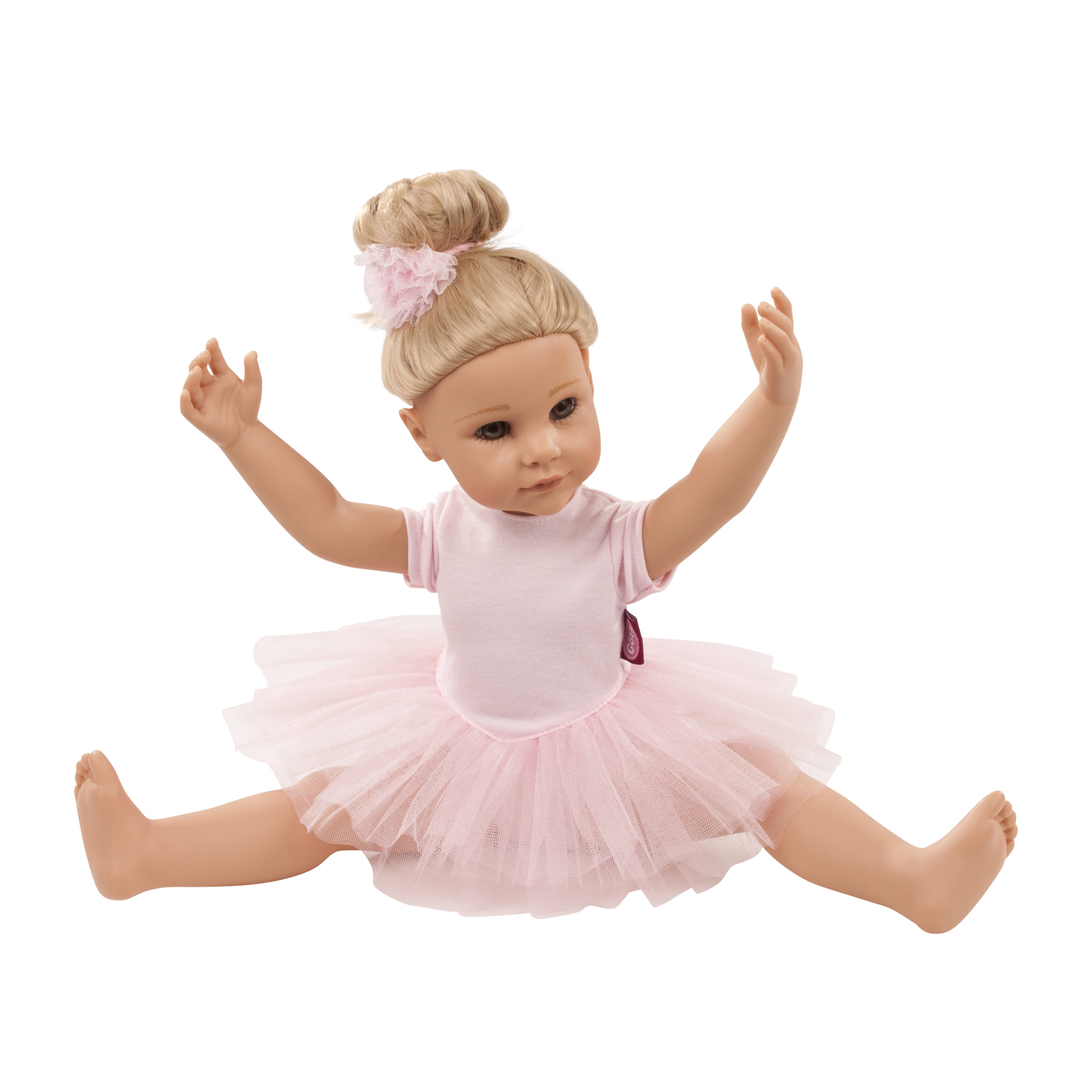 50 cm grosse blonde Stehpuppe traegt einen rosa Ballettanzug und macht einen Spagat