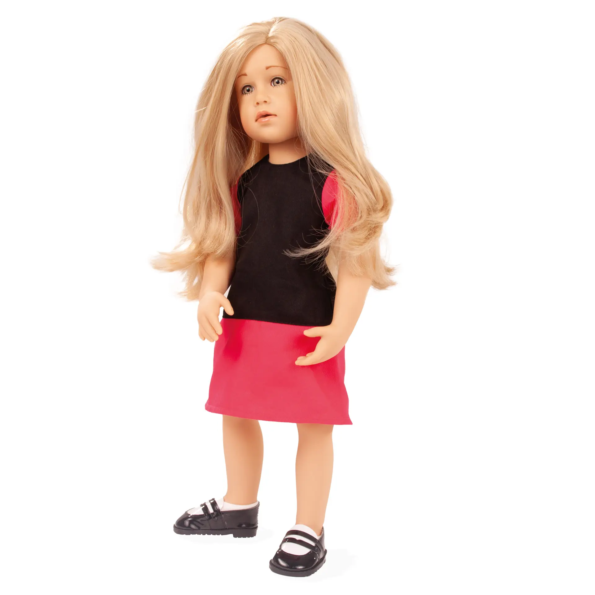 Stehpuppe 45-50 cm mit blondem Haar und steingrauen Augen. Sie trägt ein pink-schwarzes Kleid mit schwarzen Spangenschuhen und Struempfen von Goetz