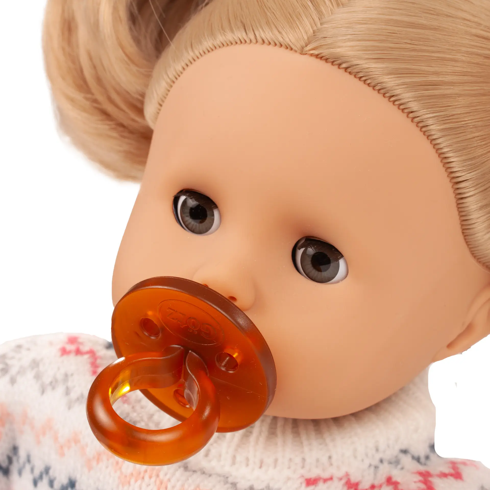 Portrait von Babypuppe Gr. 33 cm mit blondem Haar, blauen Schlafaugen und einem Schnuller von Goetz