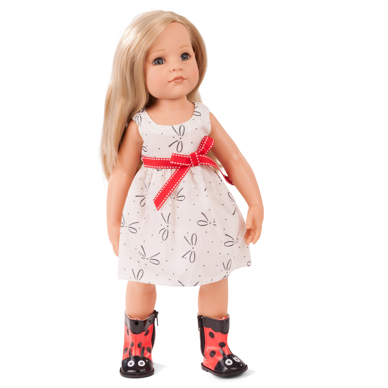 50 cm grosse blonde Stehpuppe traegt weißes Kleid mit roter Schleife und Marienkaefer-Stiefeln