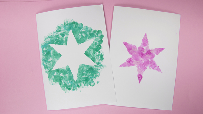 kreativ-ecke-goetz-puppen-weihnachtskarte-bild pinker und grüner Stern auf weißem Papier