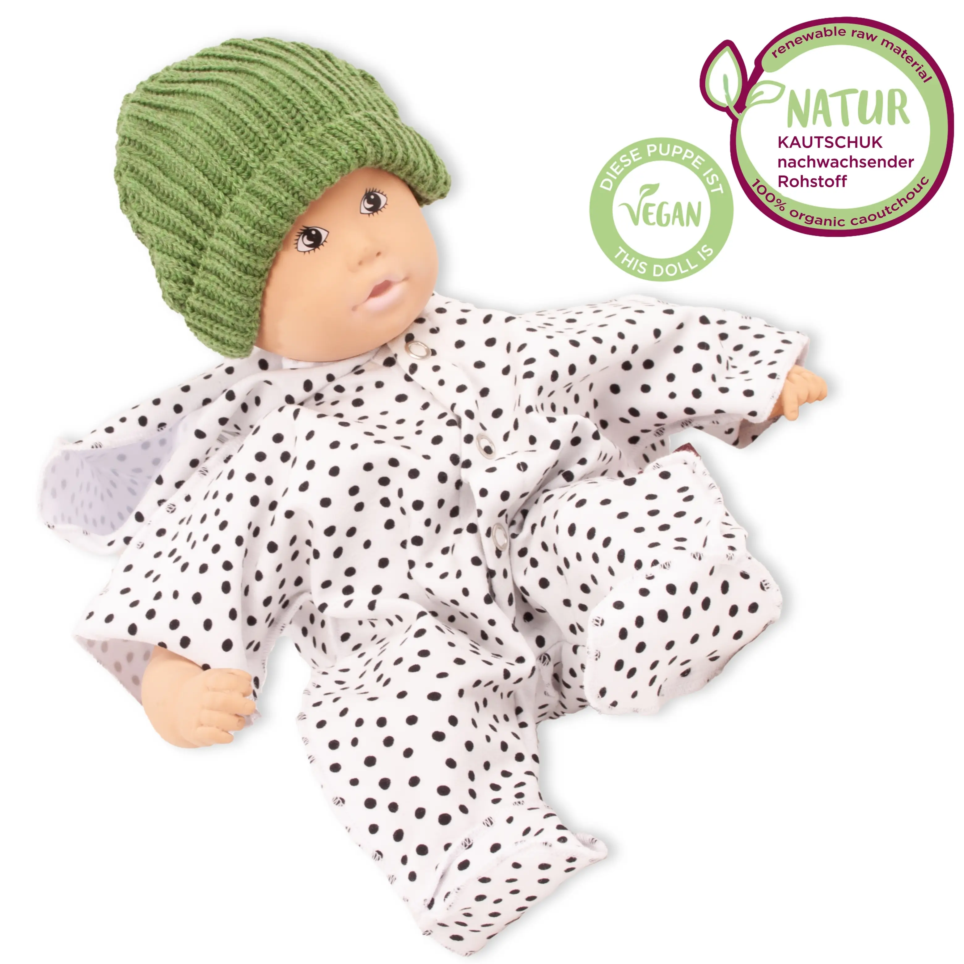 Badepuppe aus Naturkautschuk und vegan  mit gemalten Augen in einem weiss-schwarz getupftem Anzug und gruener Strickmuetze von Goetz