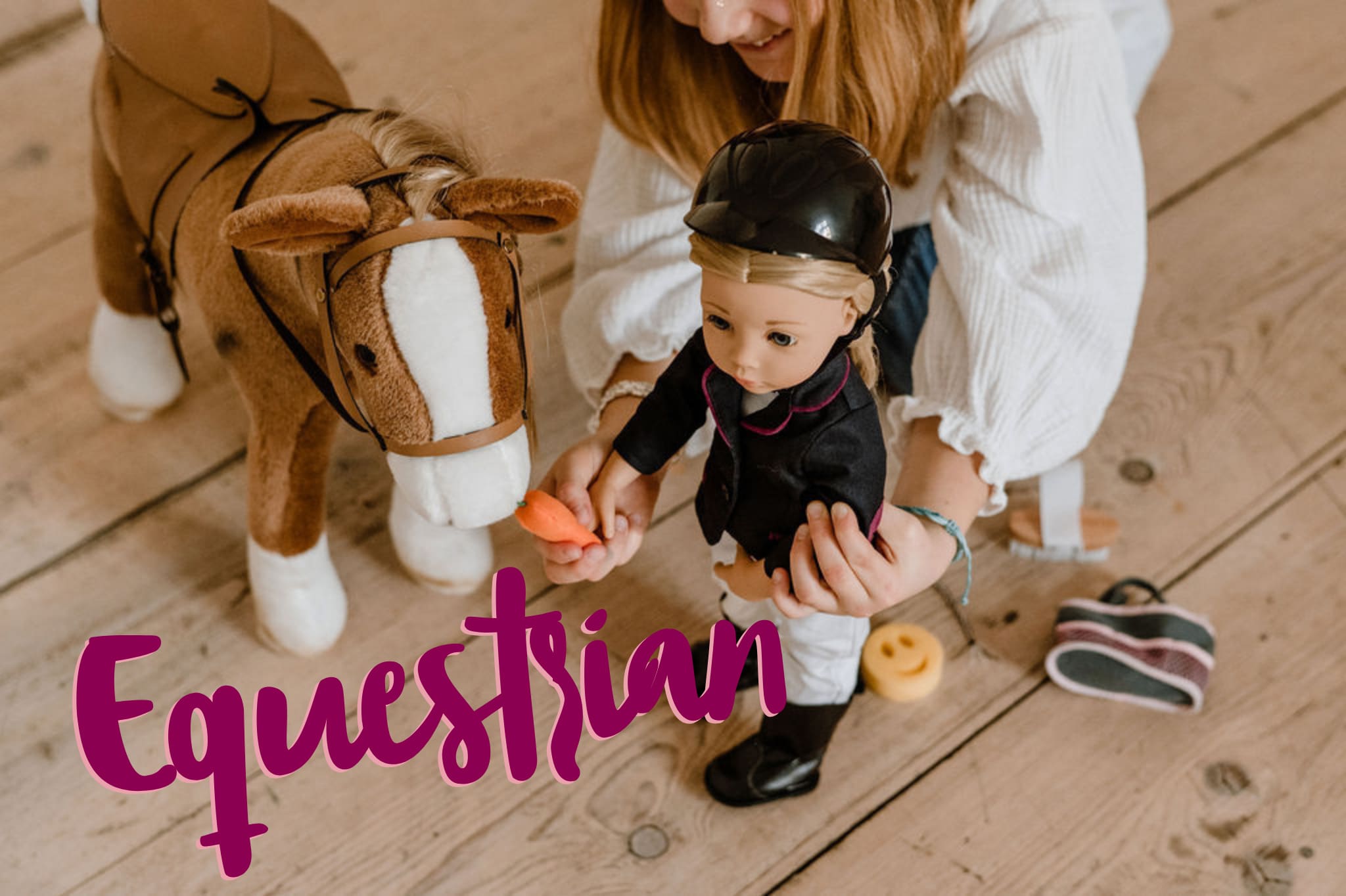 Child plays with 50 cm tall standing doll with blonde hair in riding outfit and feeds plush horse a carrot